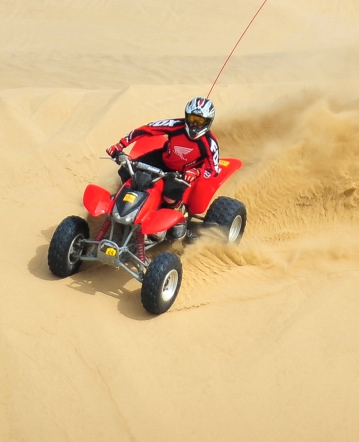 Riding through sand dunes on an ATV trail in Pismo Beach