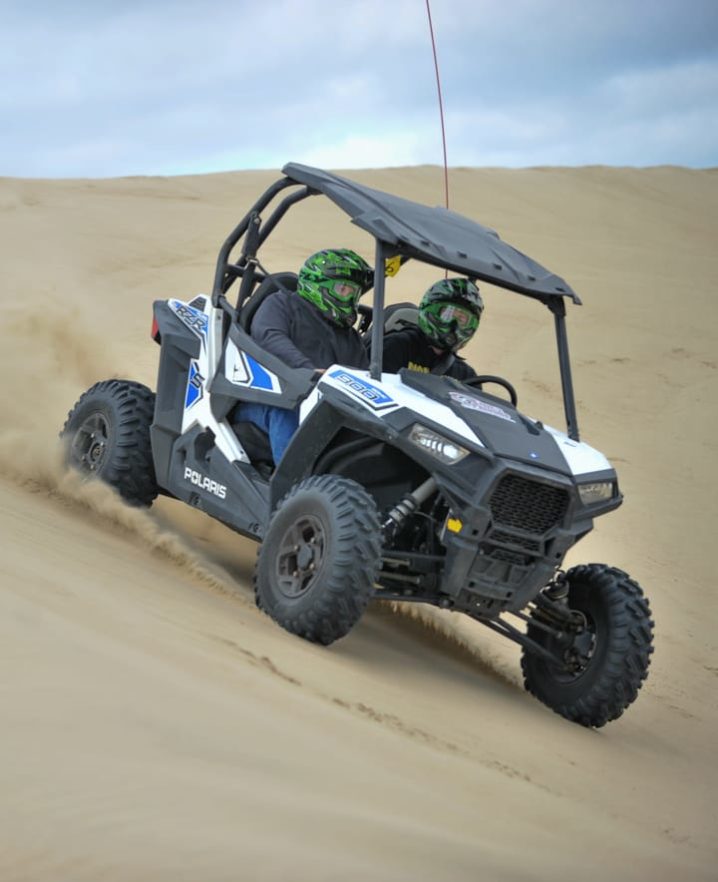 Two guest riding an UTZ downhill at Pismo Beach