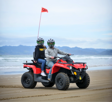 Two guests riding ATVs
