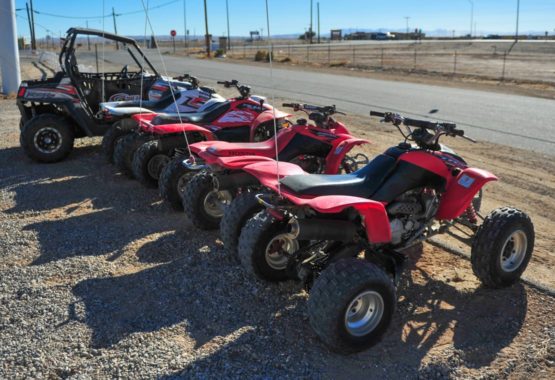ATVs and UTVs parked in a row