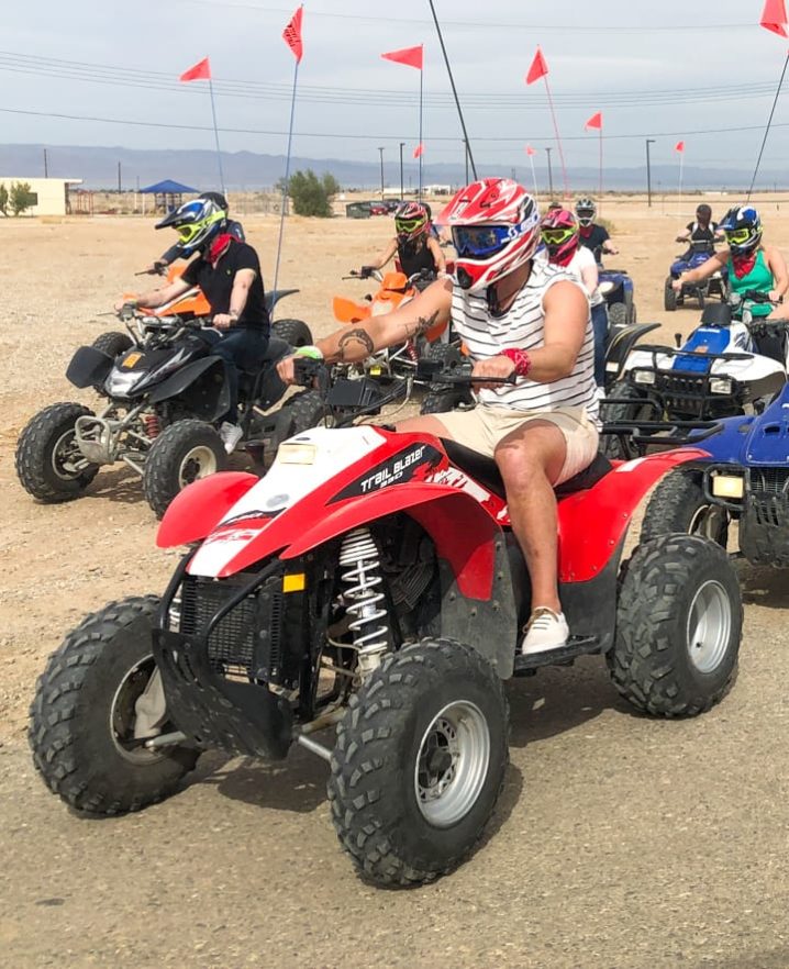 Guests sitting on ATVs, ready to ride at Palm Springs location