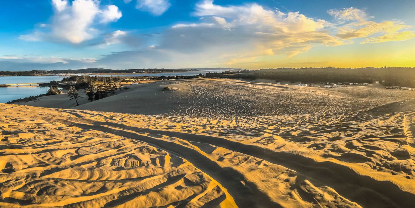 ATV at sunset on dunes in Oregon